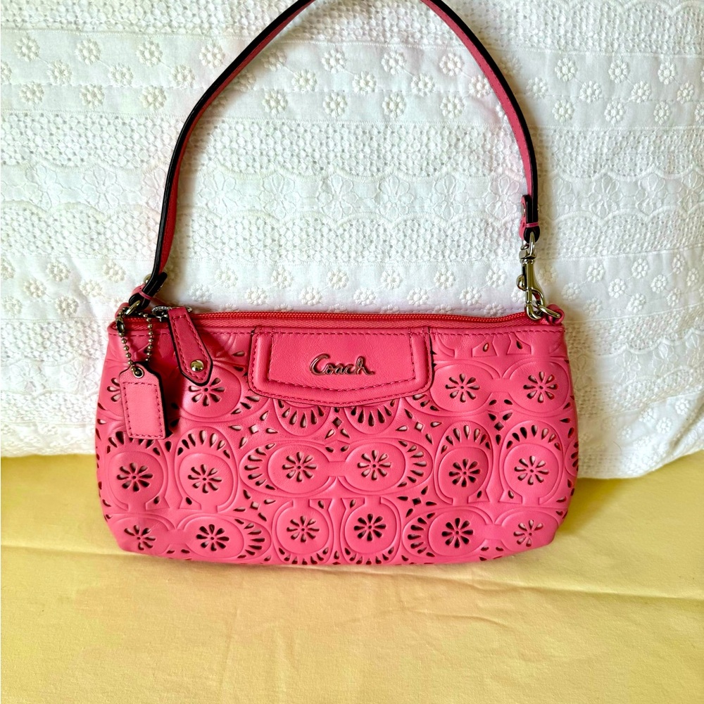 Coach leather perforated pink clutch